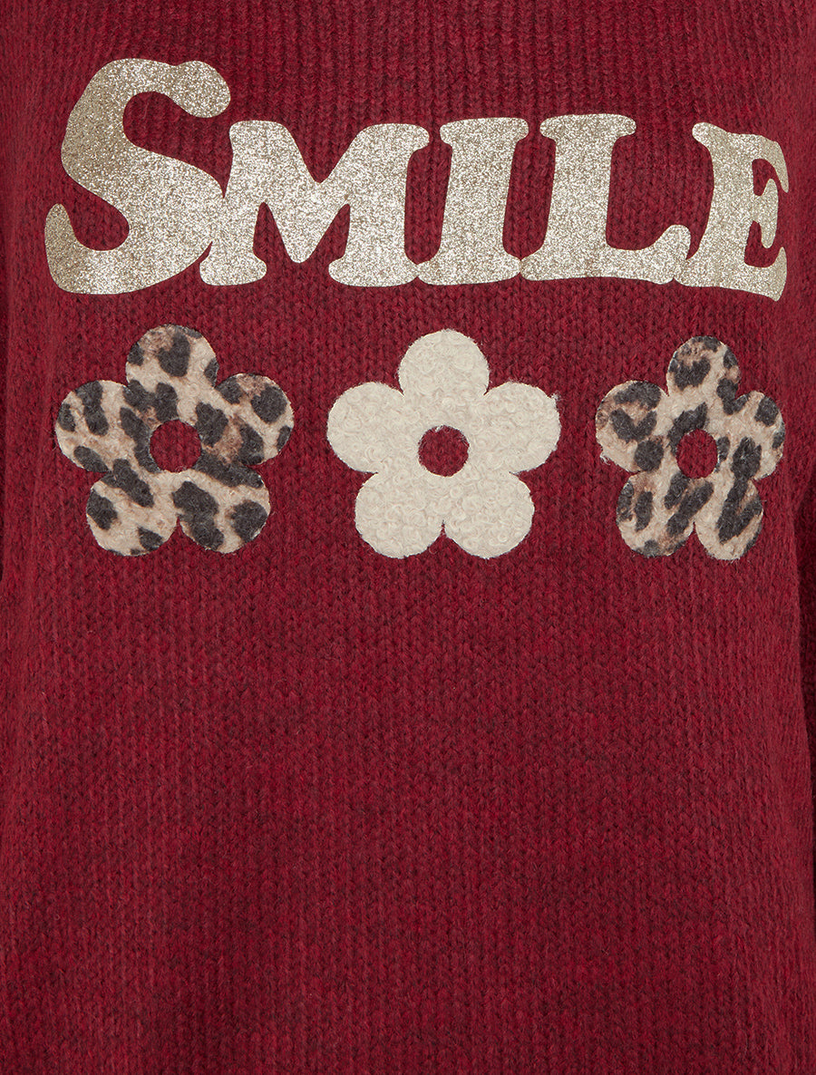 Suéter liso de punto con estampado. - Burdeos