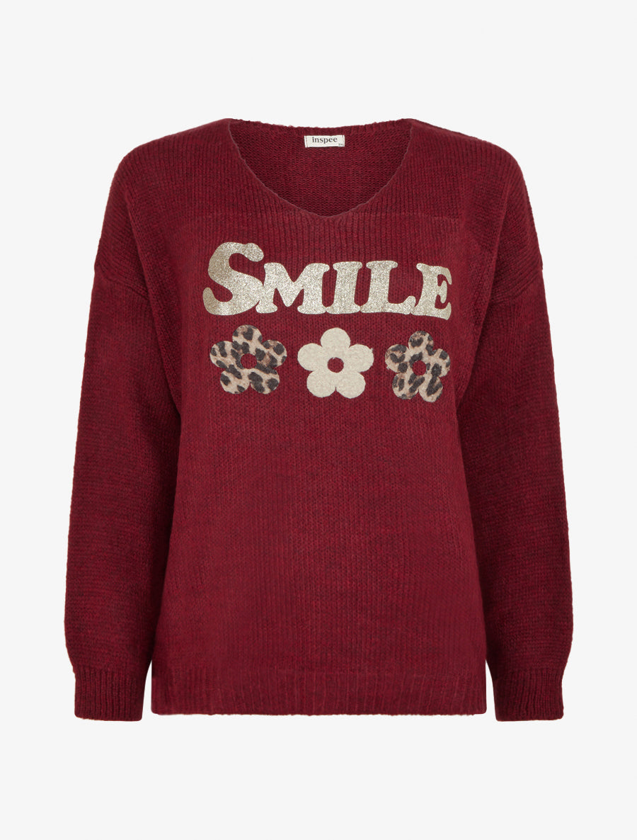 Suéter liso de punto con estampado. - Burdeos