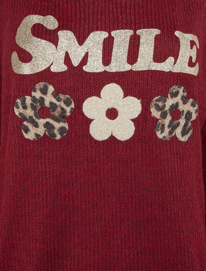 Suéter liso de punto con estampado. - Burdeos