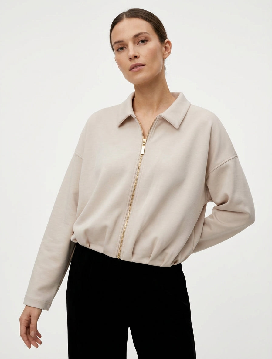 Chaqueta de corte globo con cremallera y efecto fruncido. - Beis